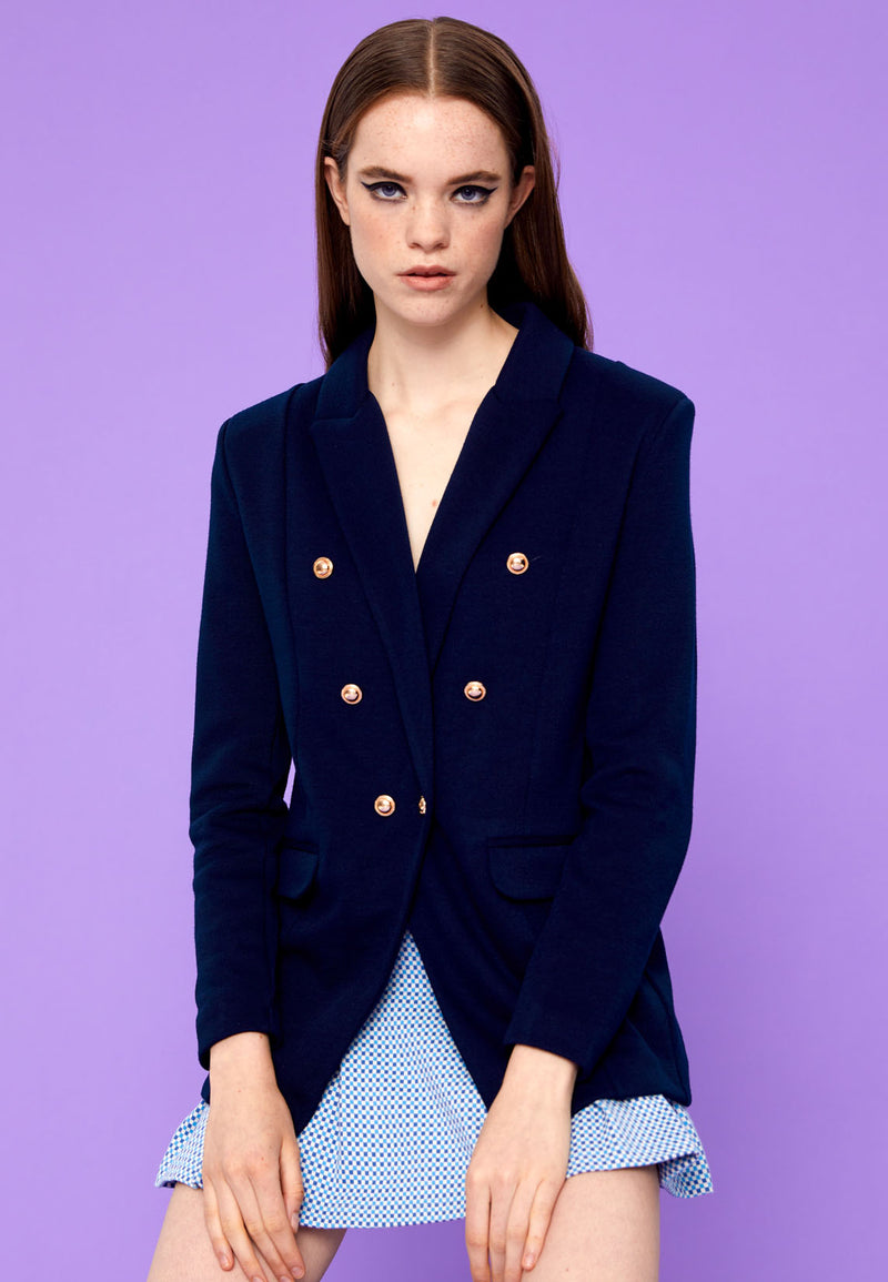 Close-up of the model in the Double-Breast Oversized Ladies Blazer in navy by Gen Woo