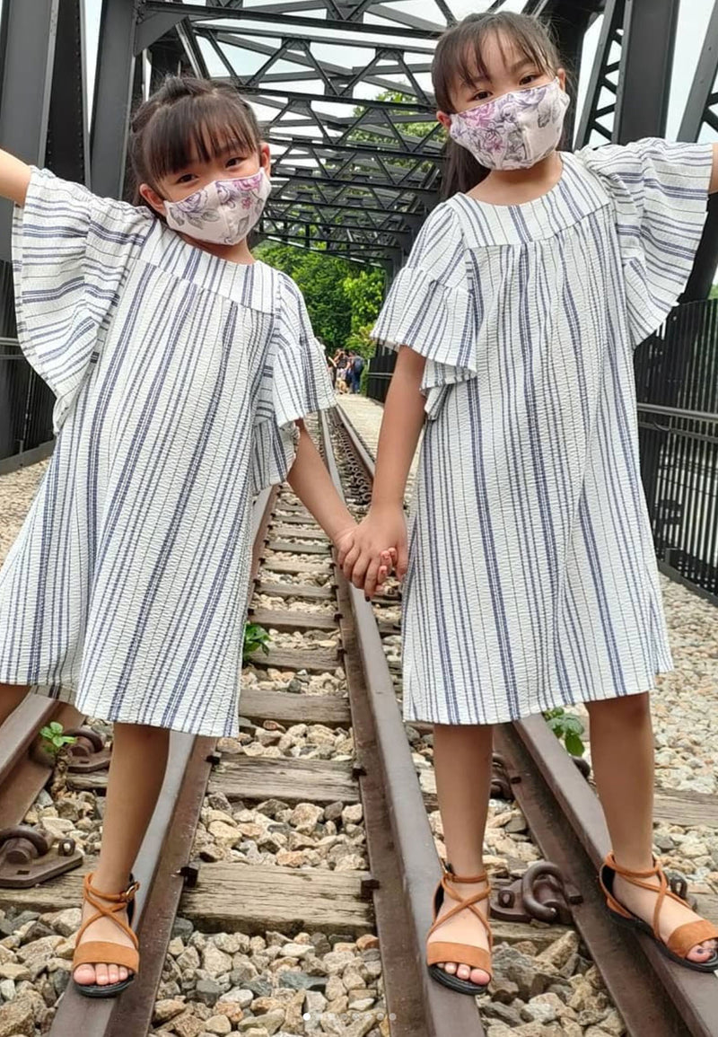 Both girls wearing matching Girls Striped Flutter Sleeve A-Line Dresses by Gen Woo
